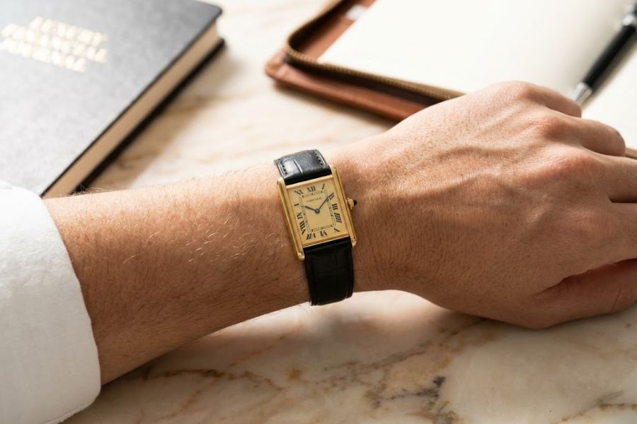 Tank Louis Cartier on a wrist in bright room Tank Louis Cartier on a wrist in bright room
